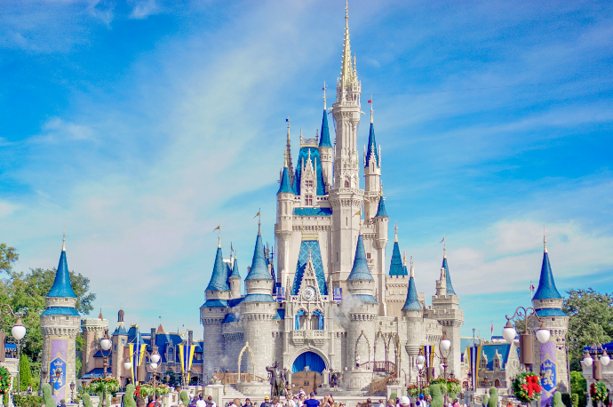 a large castle with a lot of people around it